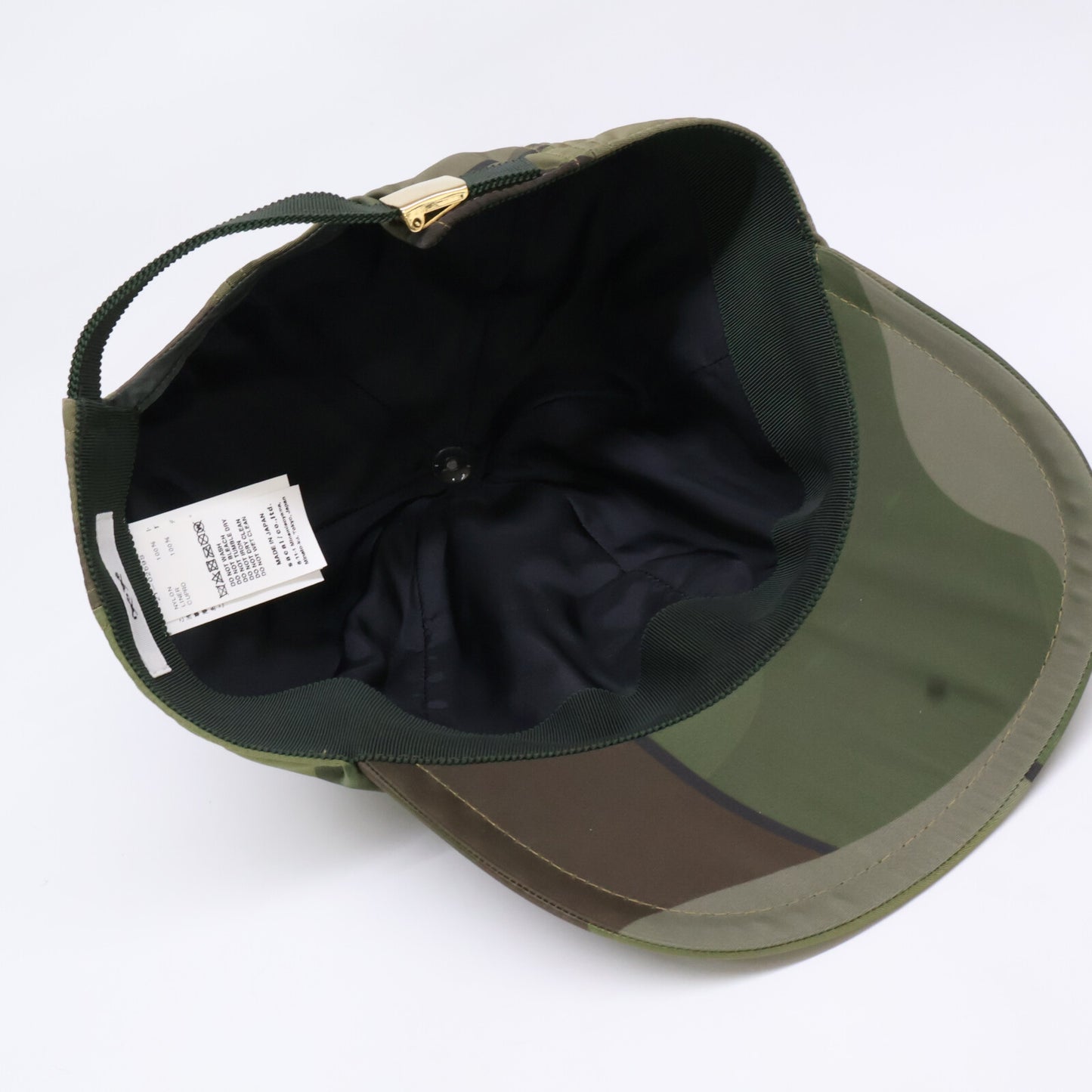 sacai KAWS 21SS Camo S-Logo Nylon Cap Green Size ONE SIZE