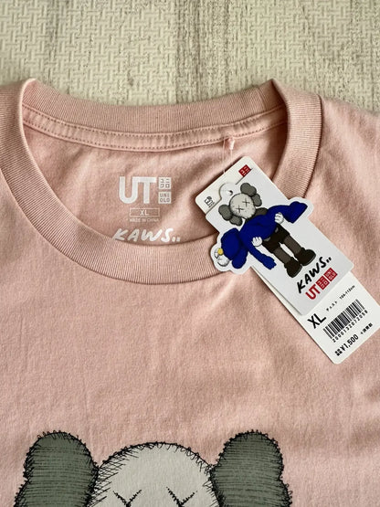 Vintage UNIQLO Tops - UNIQLO x KAWS Short Sleeve T-Shirt Peach XL - Authentic Archive