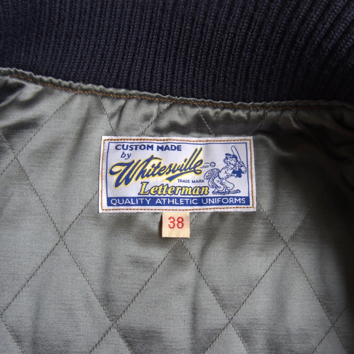 Whitesville Embellished leather-sleeved varsity Size 38